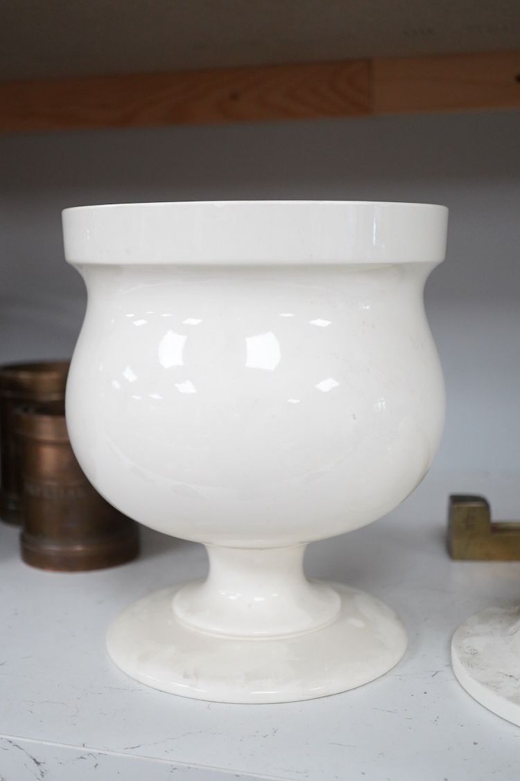 A Victorian pottery pedestal leeches jar and pierced cover, with the remains of the painted word ‘leeches’ around the body of the jar, 30.5cm high
